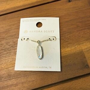 Kendra Scott Eva Quartz small 14K gold over brass long mother of pearl pendant.